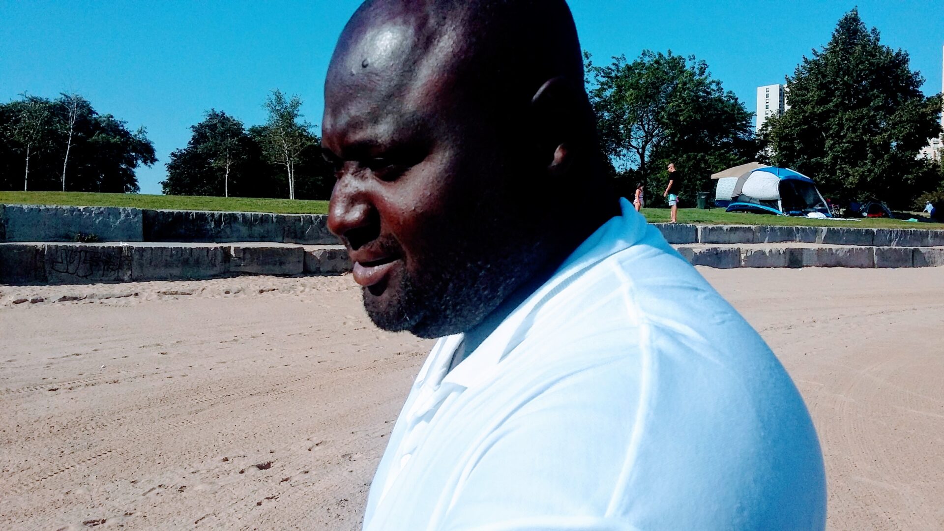 An African-American Man Wearing a White Shirt