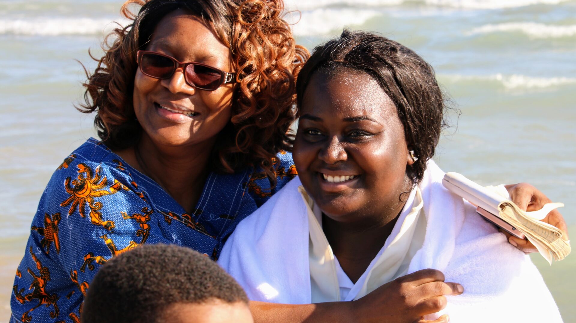 A Woman Wearing White Beside a Woman Wearing Blue