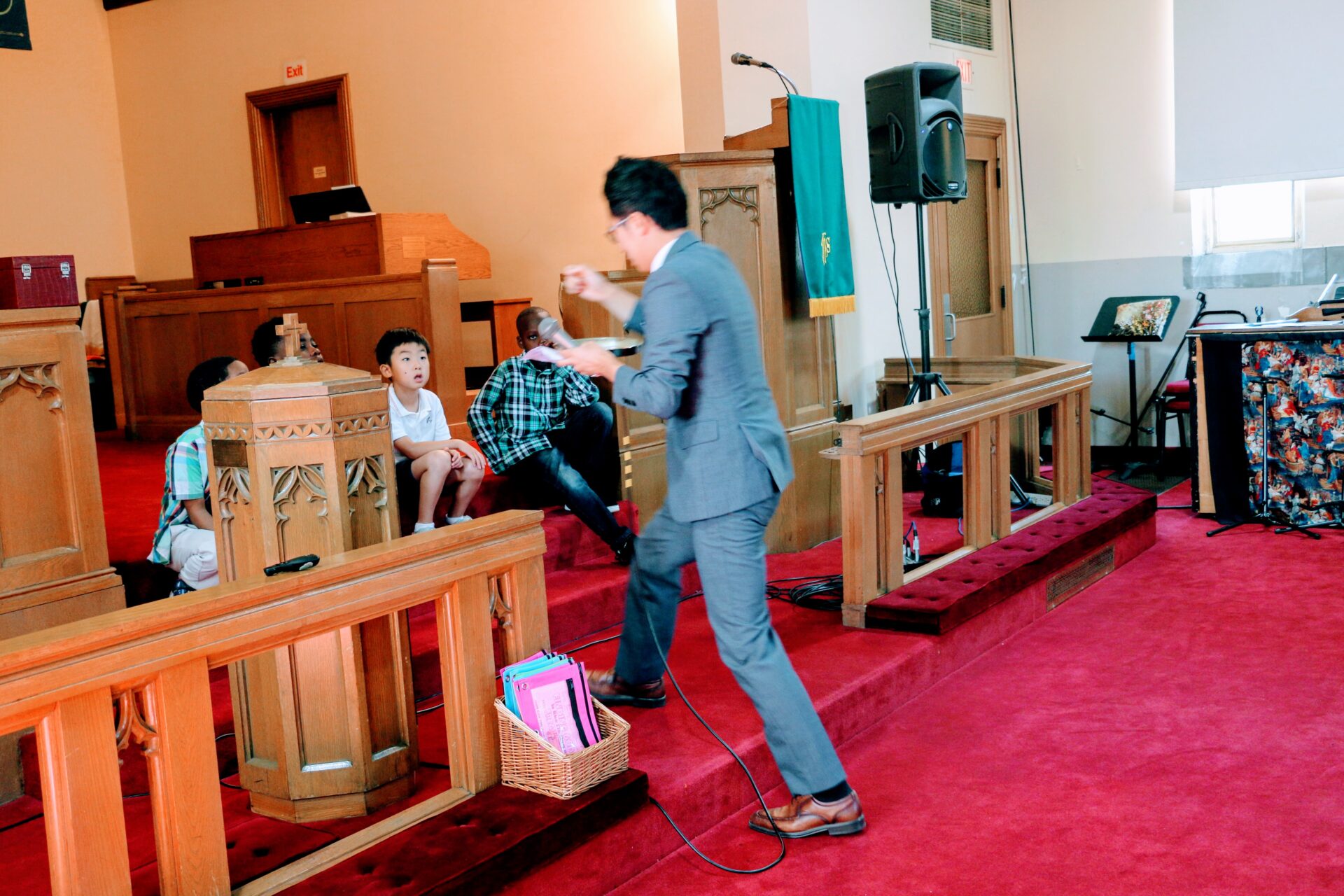 A Man and Kids Inside a Church