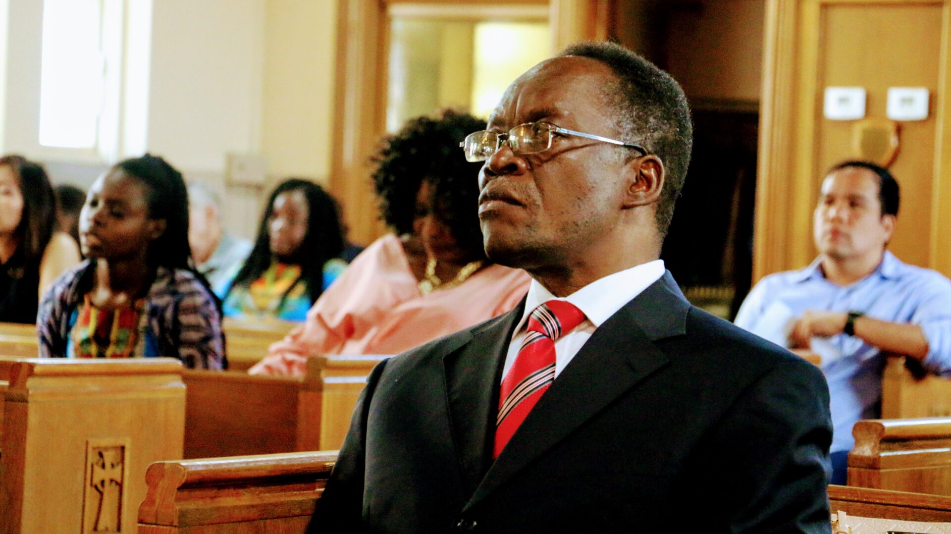 An Old Man Attending Church Service