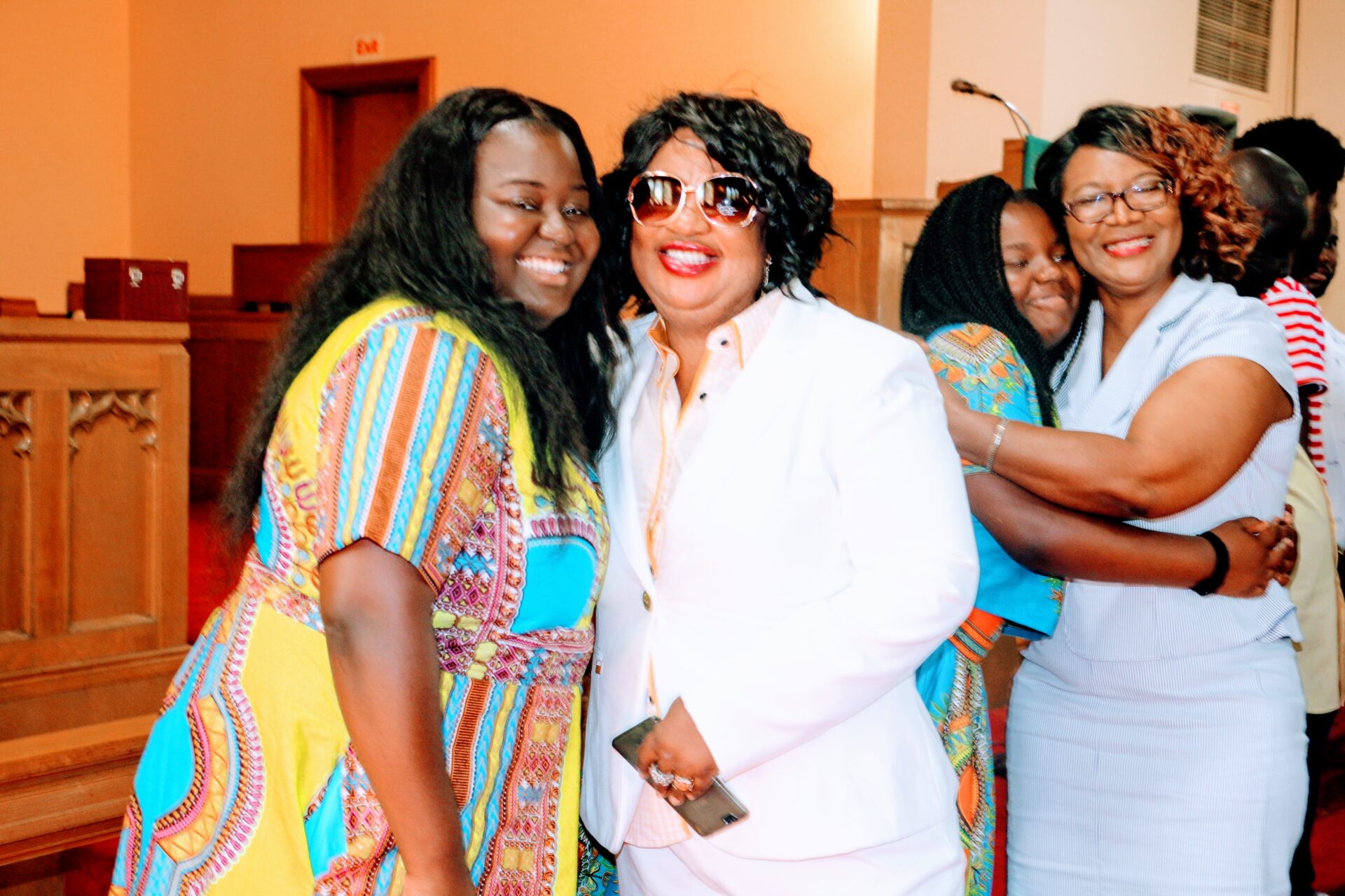 Women Hugging Each Other Inside the Church