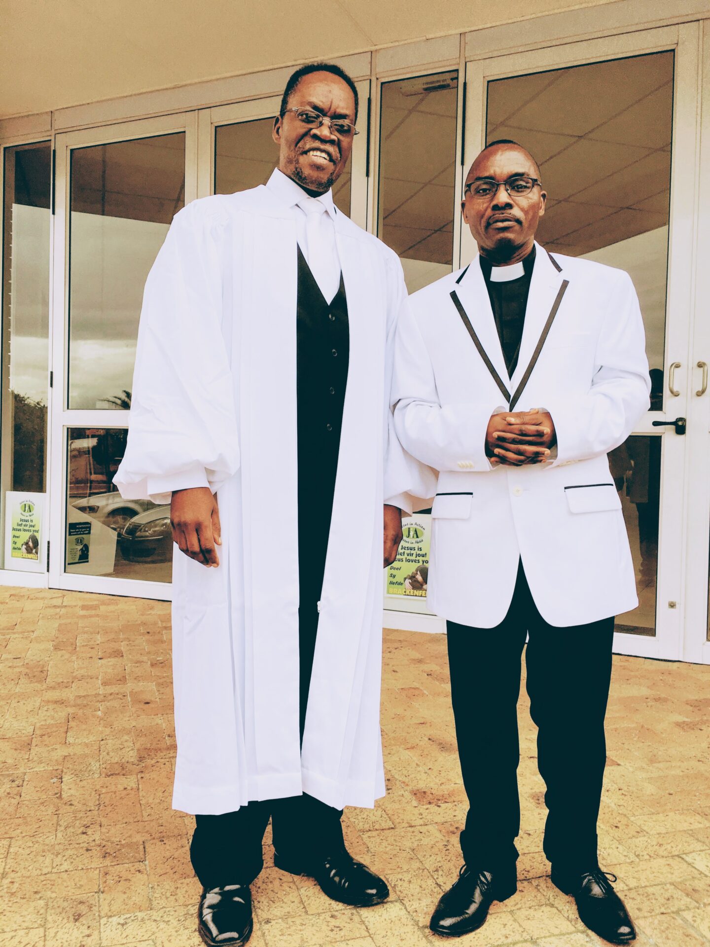 Two Men Wearing Church Clothing