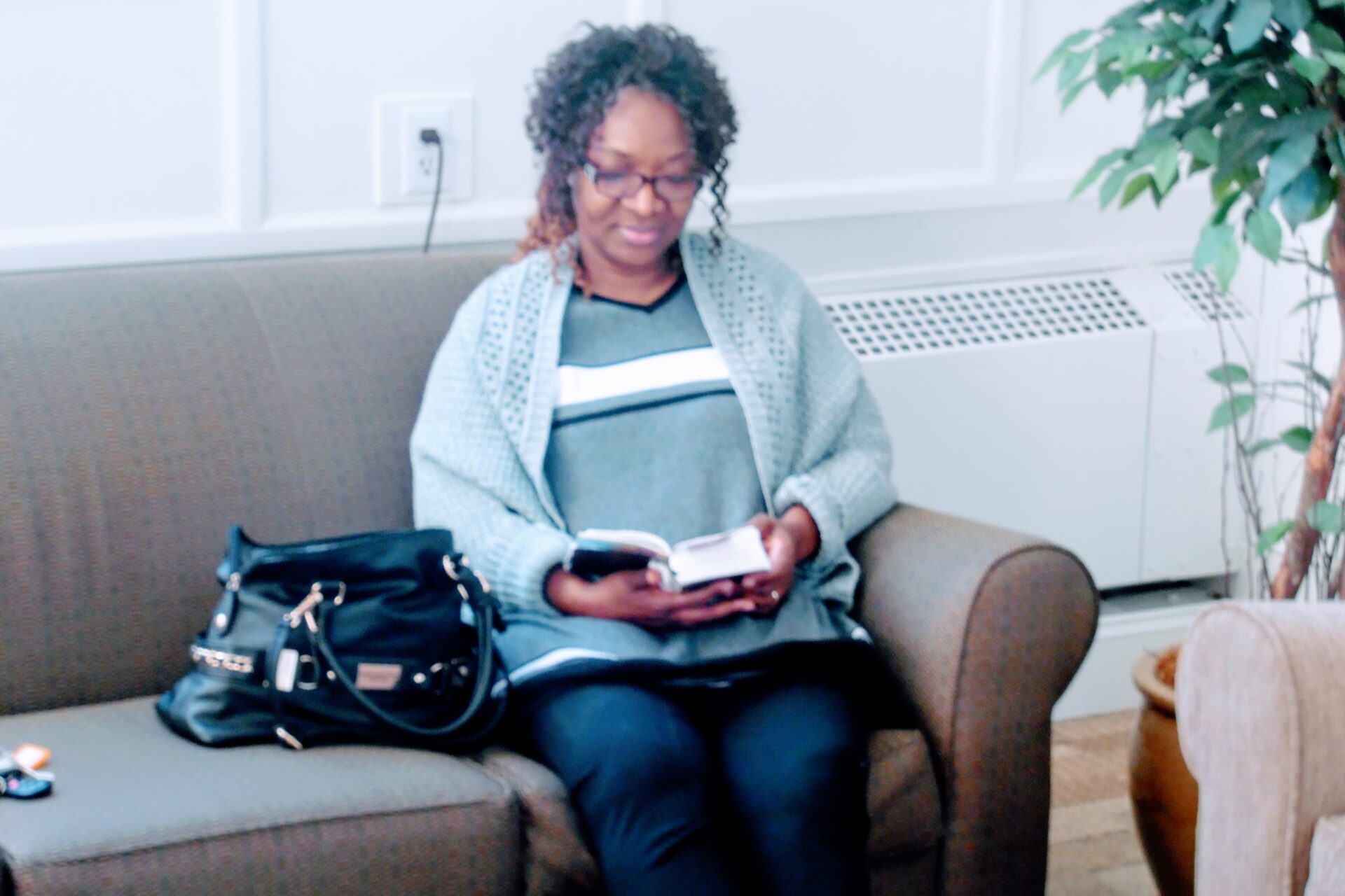 A Woman Reading the Bible on the Couch