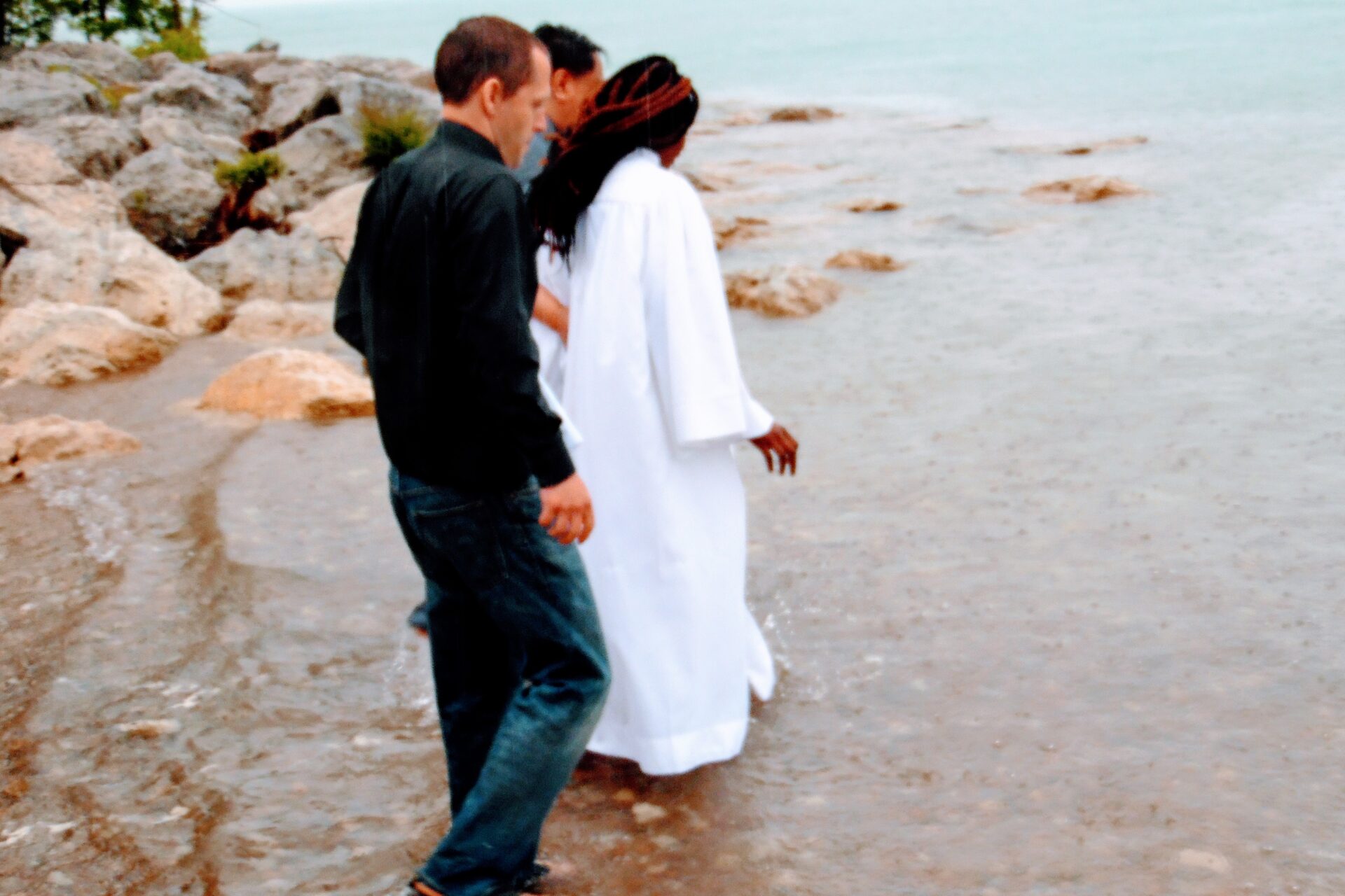 A Woman Wearing White Going Toward the Beach