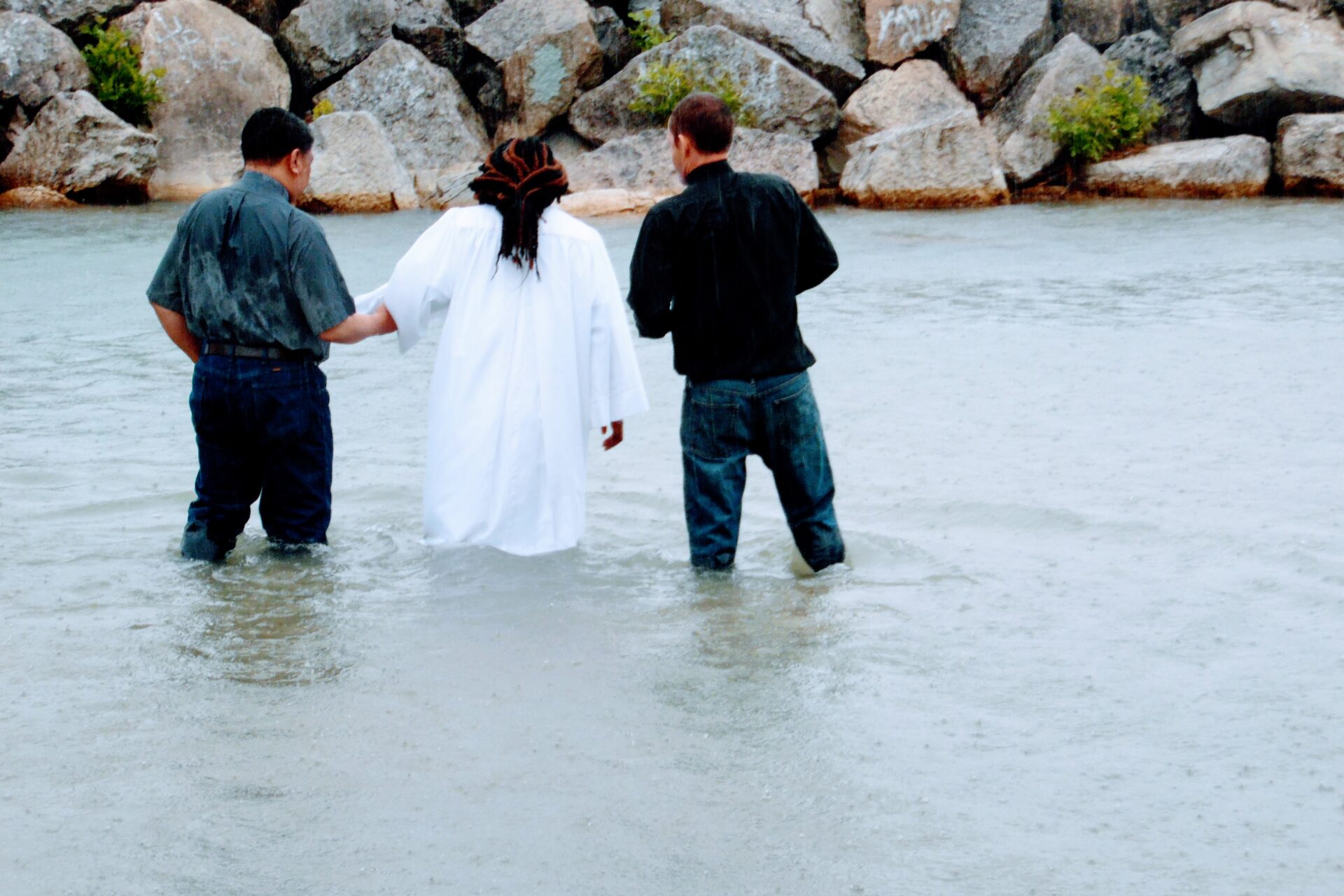 Two Men and a Woman Going Toward the Beach