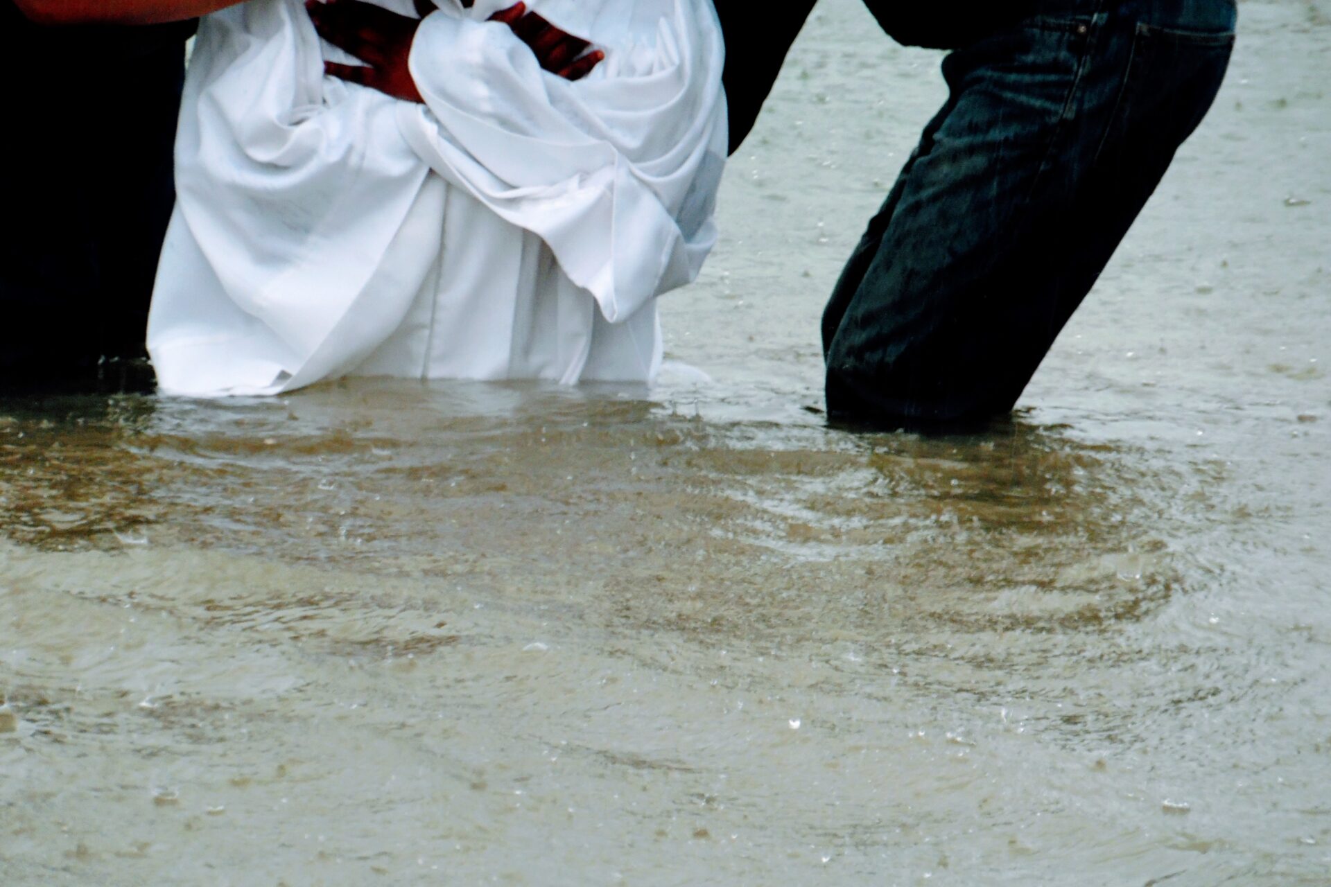 A Woman Wearing White While Raining