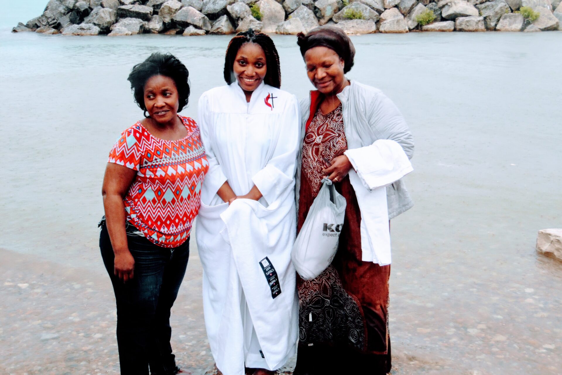 Two Old Woman Beside a Woman Wearing White