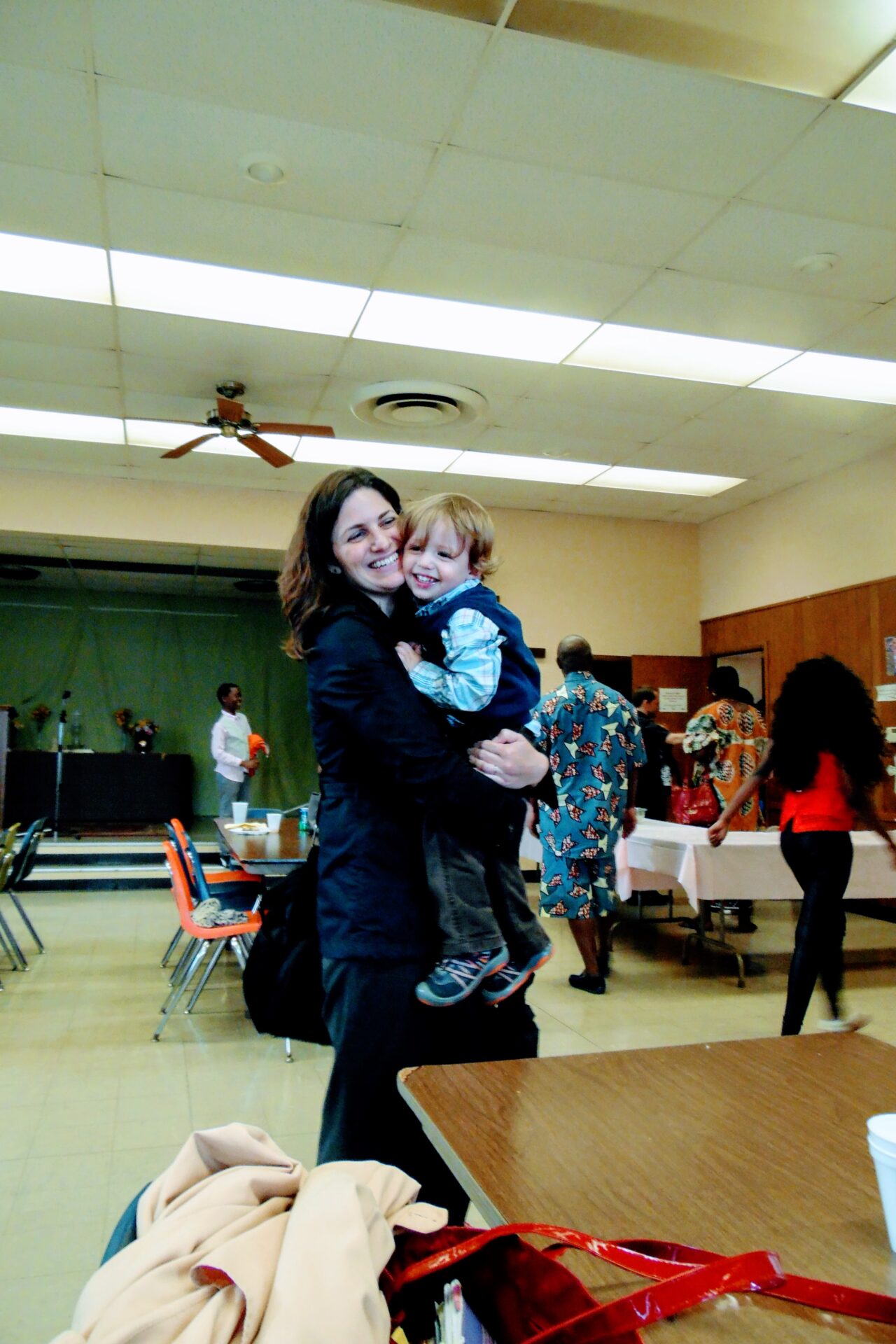 A Woman Carrying a Baby Boy